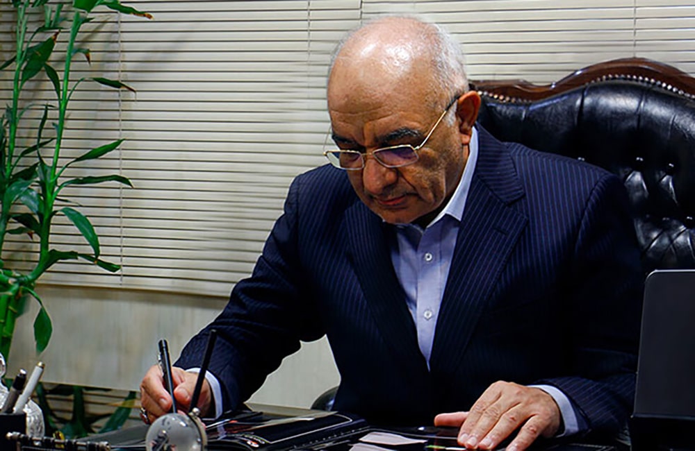 Professor Mahmoud Jabbarvand reviewing medical documents and ophthalmology research.