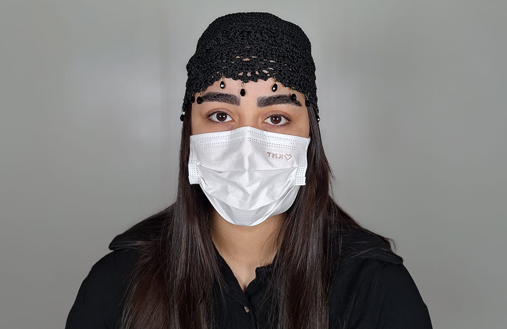 Female patient with natural dark brown eyes before Magical Gray eye color change by keratopigmentation at Chromatic Eyes Medical Center, Vanak Square, Tehran, Iran